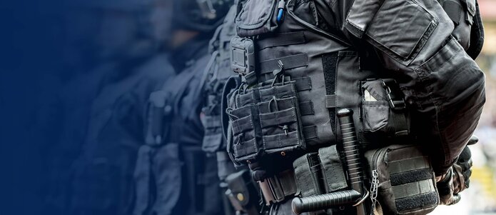 Aerospace & Ballistic Protection industry header image consisting of police officers in protective gear  