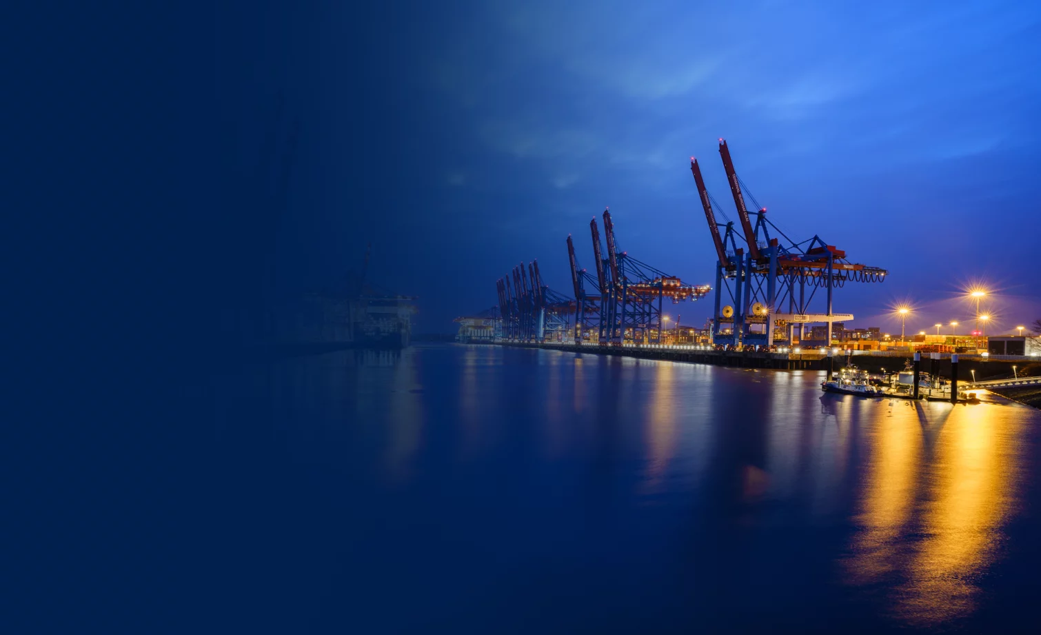 Current Transmission industry header image consisting of crane port facility