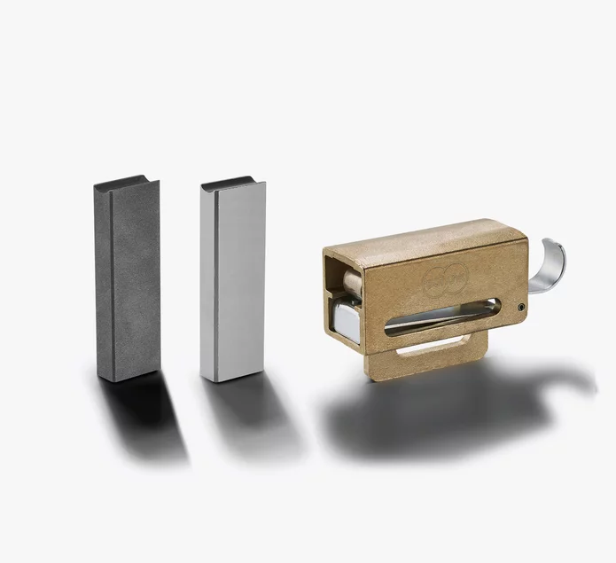  Three brush types for electric motors: graphite brush, metal-graphite brush, and integrated brush holder with spring.