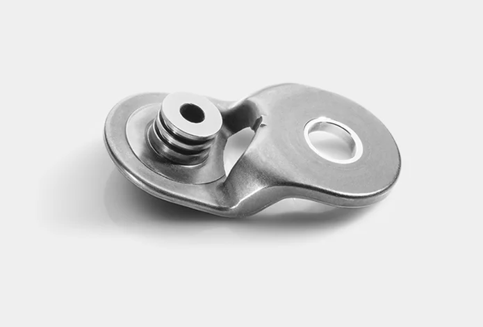  Precision metal component with smooth surface and functional openings, suitable for technical and industrial applications.