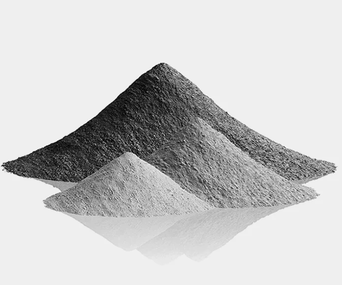  Three piles of powder in different shades of grey, representing materials with different properties, against a neutral background.