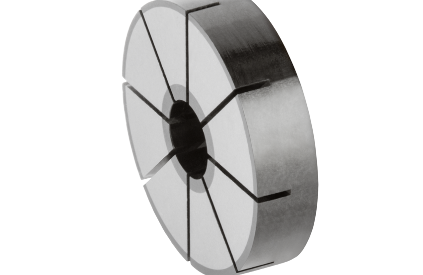  Carbon disc with segmented structure and central hole, shown against a transparent background.