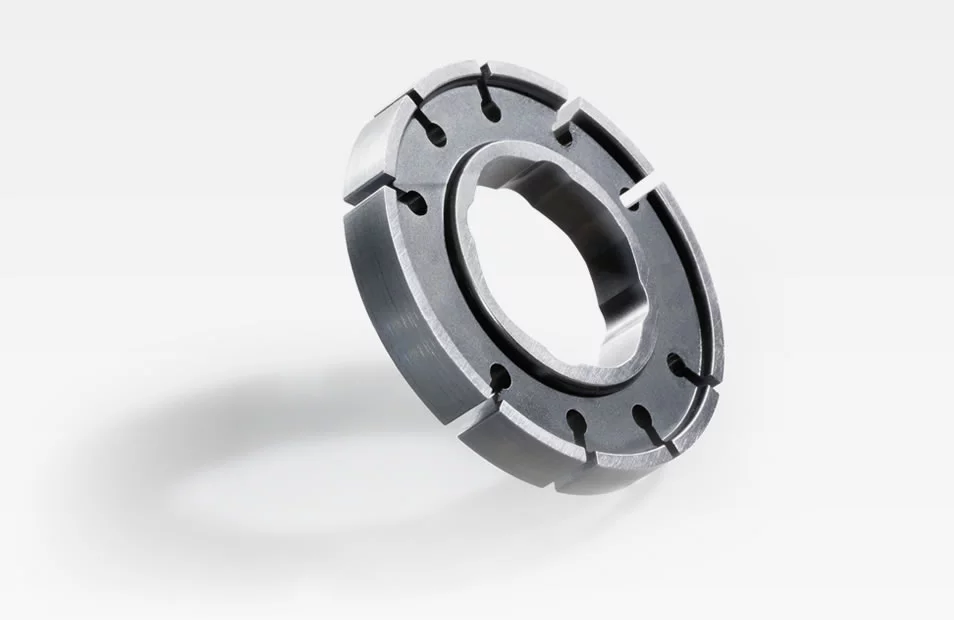  Metal rotor for oil pump with curved inner opening and precise slots, shown against a white background