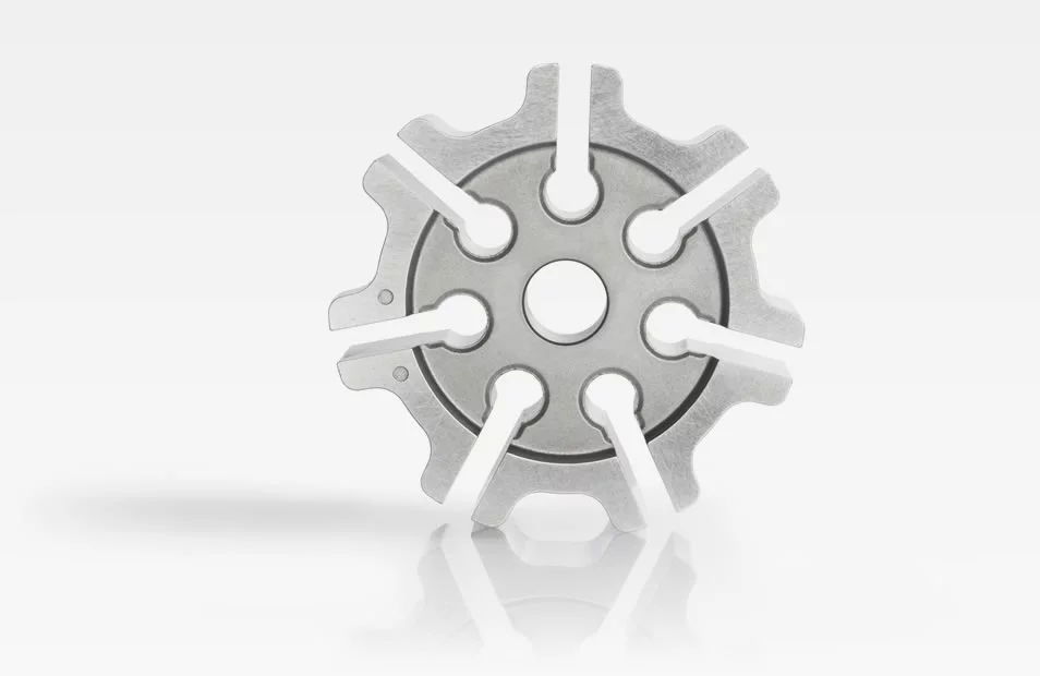  Metal rotor for oil pump with serrated outer edges and a central hole, shown against a white background