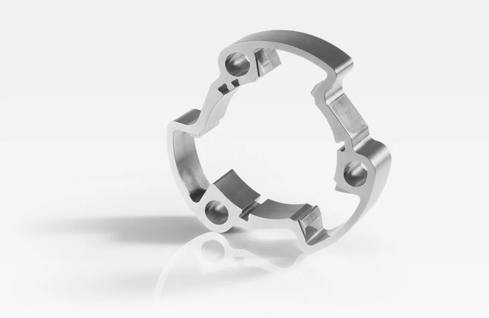  Metal stator without sprocket with precise cutouts and mounting points, shown against a white background