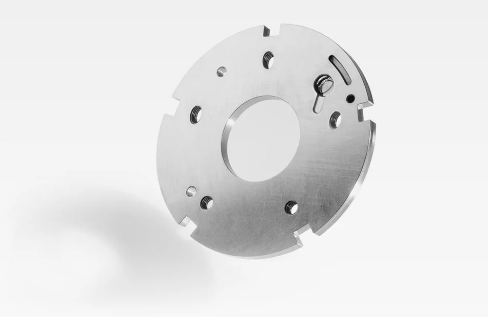  Metal locking disc with central opening, mounting holes, and cutouts, shown against a white background