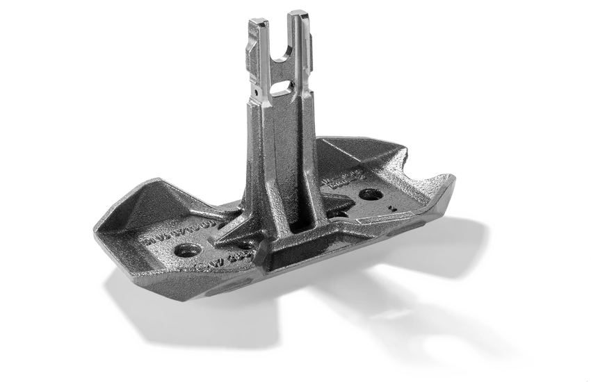  Third-rail cast collector shoe with integrated predetermined breaking point for conventional steel busbars