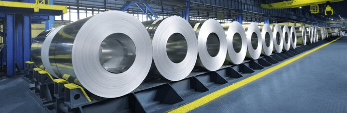  picture of metal rolls in a factory