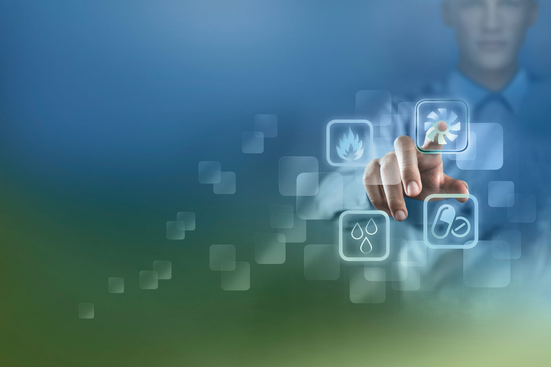 A hand symbolically touches one of four buttons, which symbolically stand for environmental simulation, thermal engineering, air conditioning technology and pharmaceutical technology. 