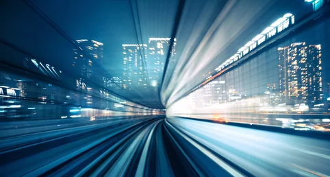  Snapshot of a moving image from inside a fast moving vehicle, in the background is an urban skyline